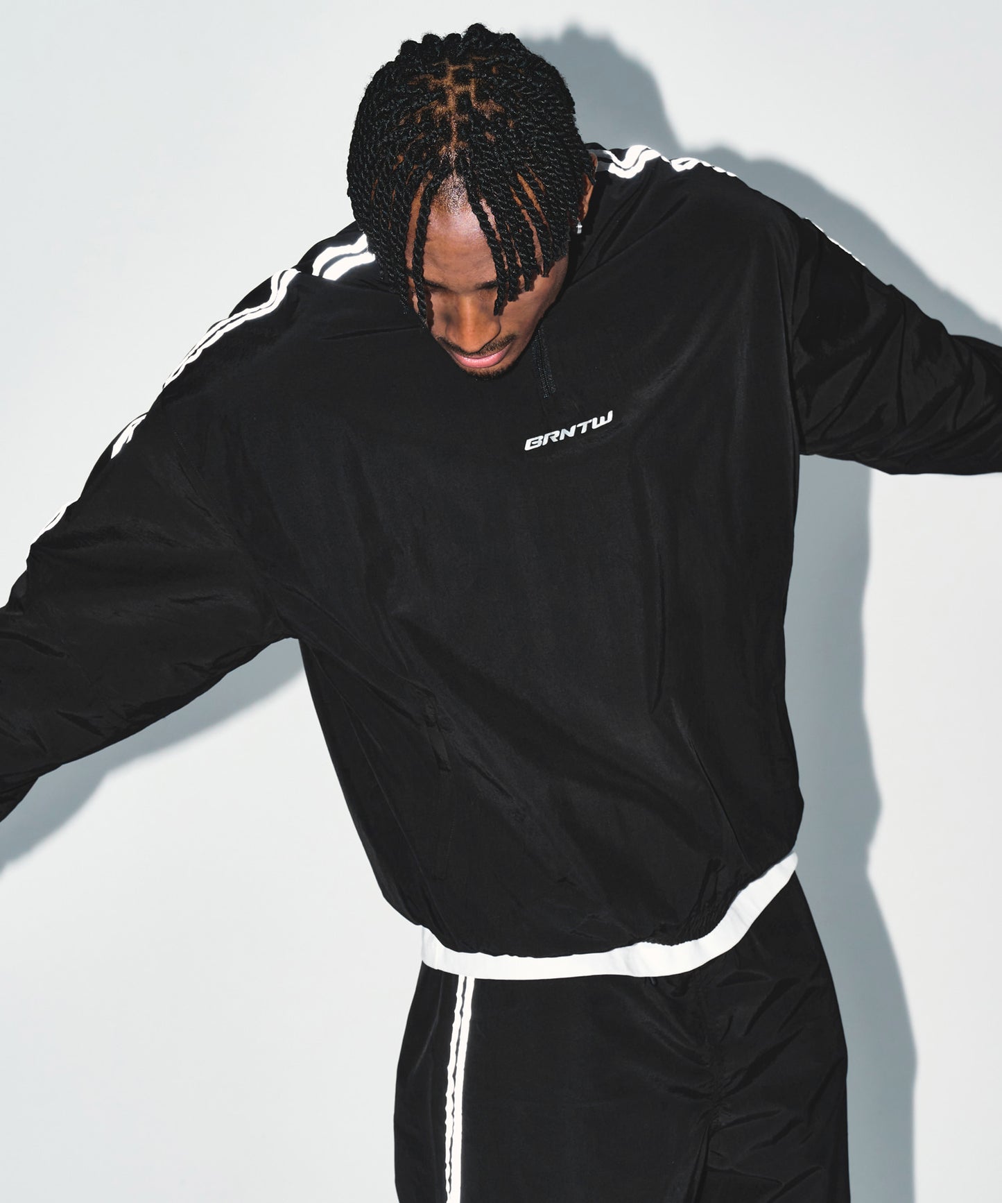 REFLECTIVE LINE BIG SYMBOL ANORAK JACKET [BLACK]