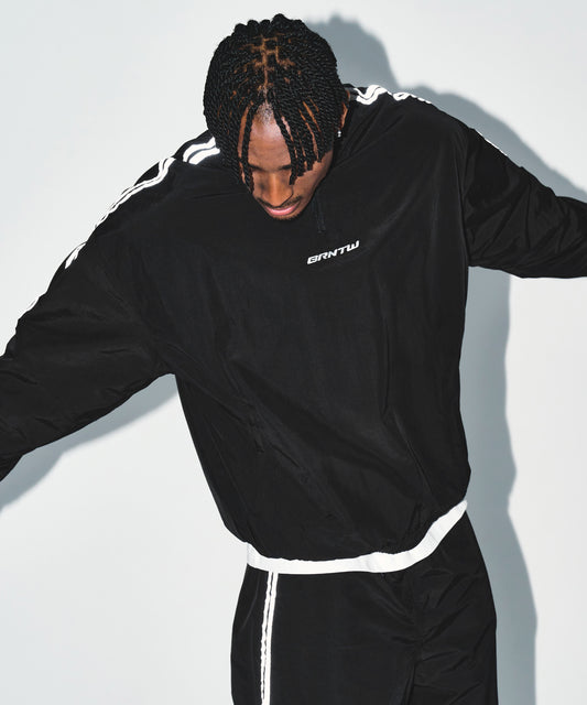 REFLECTIVE LINE BIG SYMBOL ANORAK JACKET [BLACK]