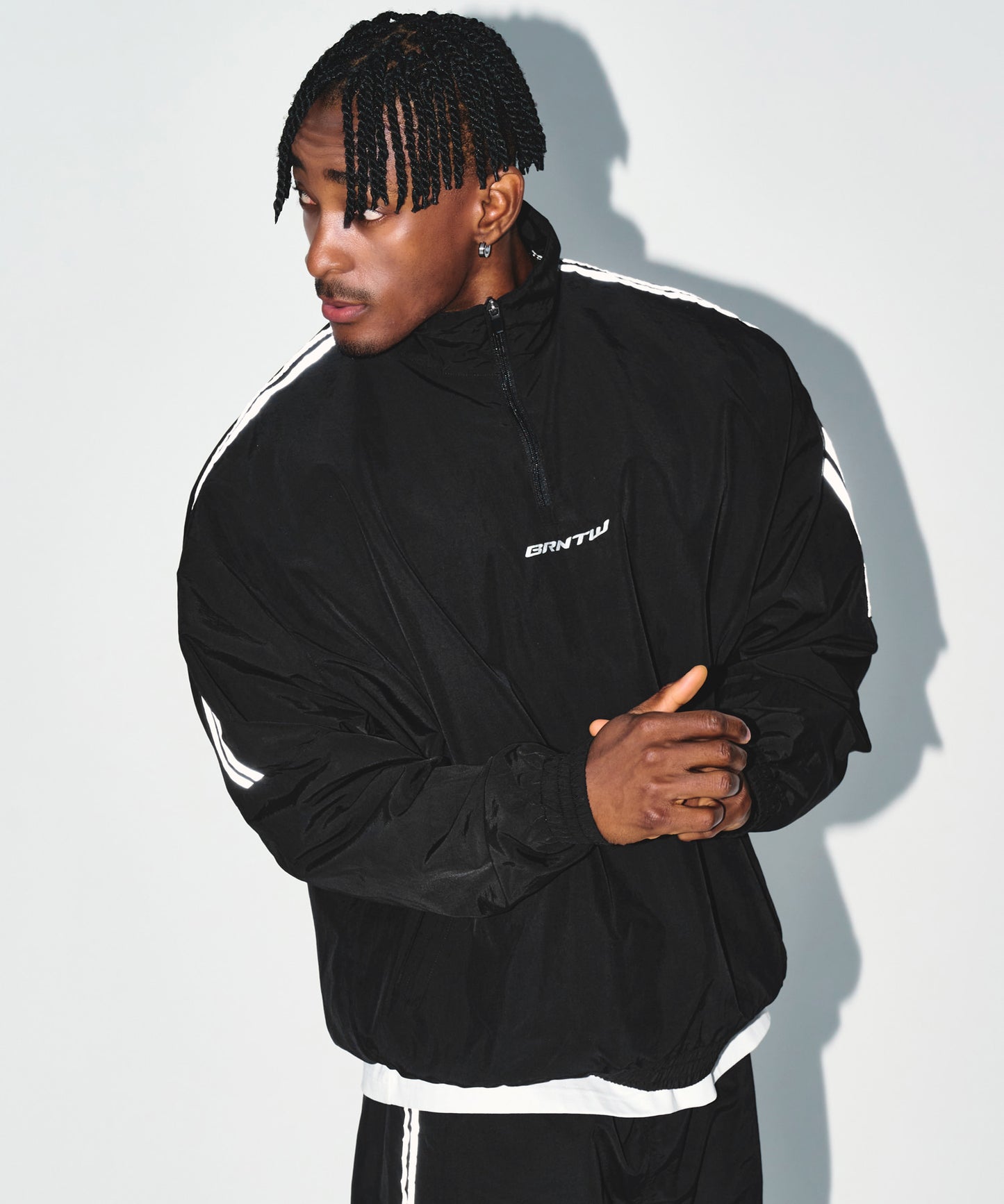 REFLECTIVE LINE BIG SYMBOL ANORAK JACKET [BLACK]
