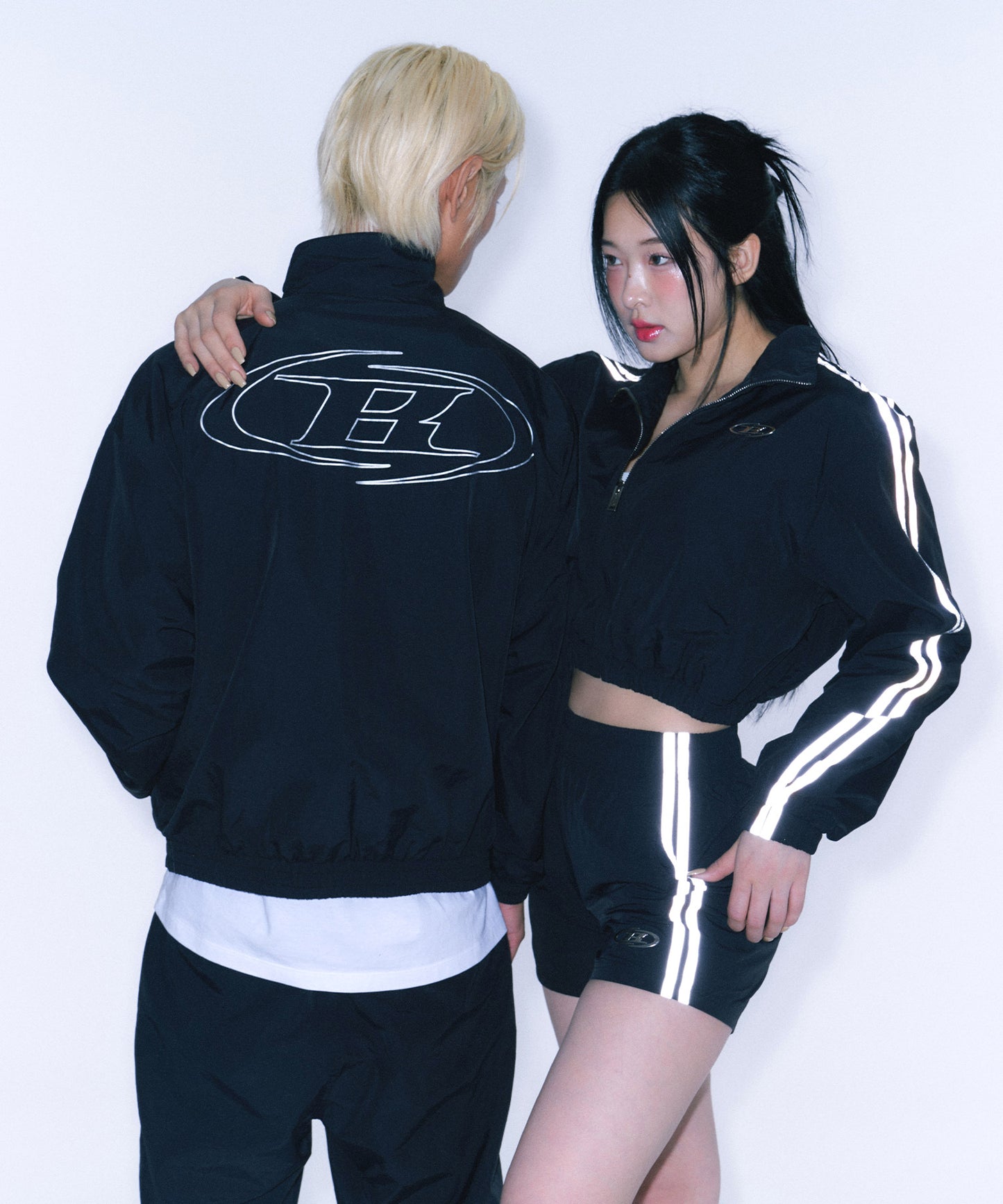 REFLECTIVE LINE BIG SYMBOL ANORAK JACKET [BLACK]