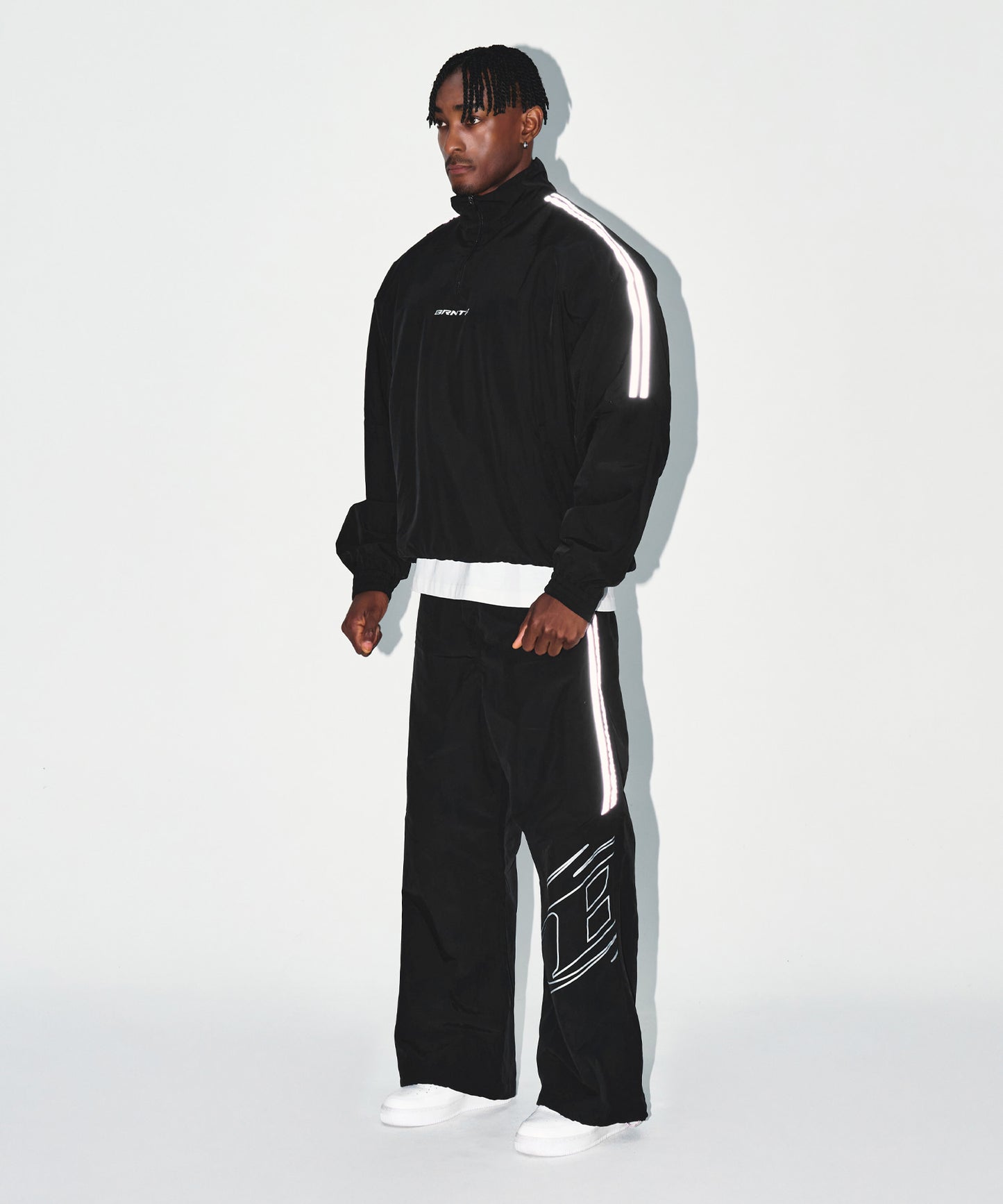 REFLECTIVE LINE BIG SYMBOL ANORAK JACKET [BLACK]